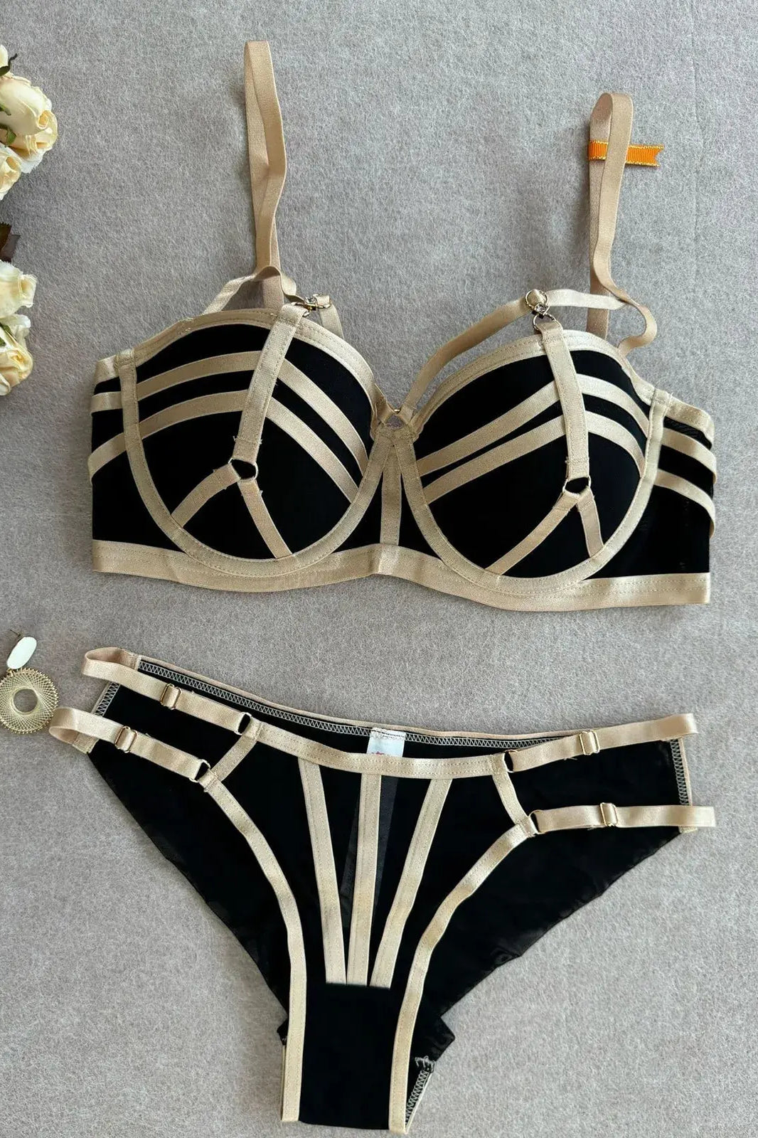 Black bra and thong set full-body view with structured design layout