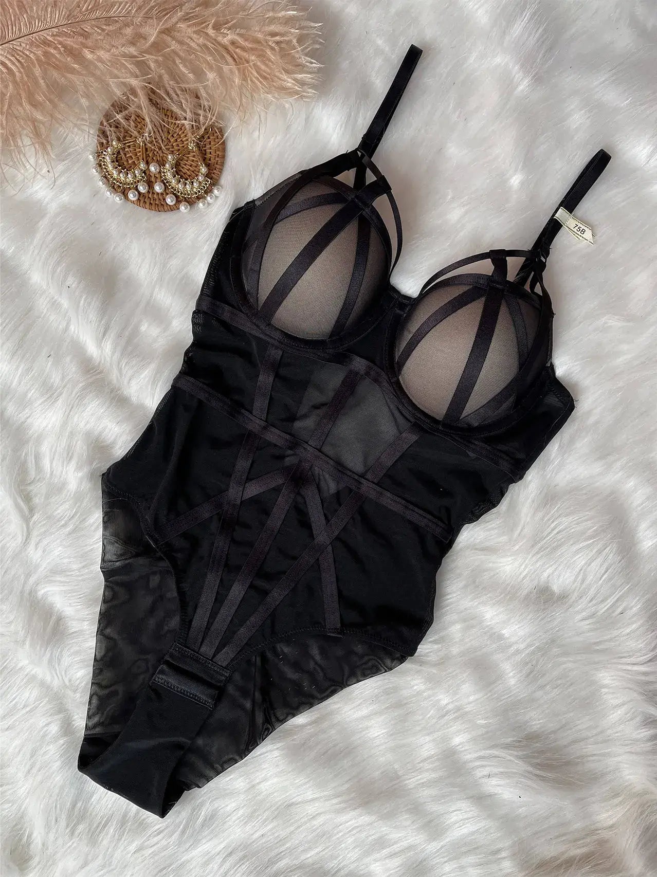 Black sheer mesh bodysuit showing lightweight fabric and sensual design style.