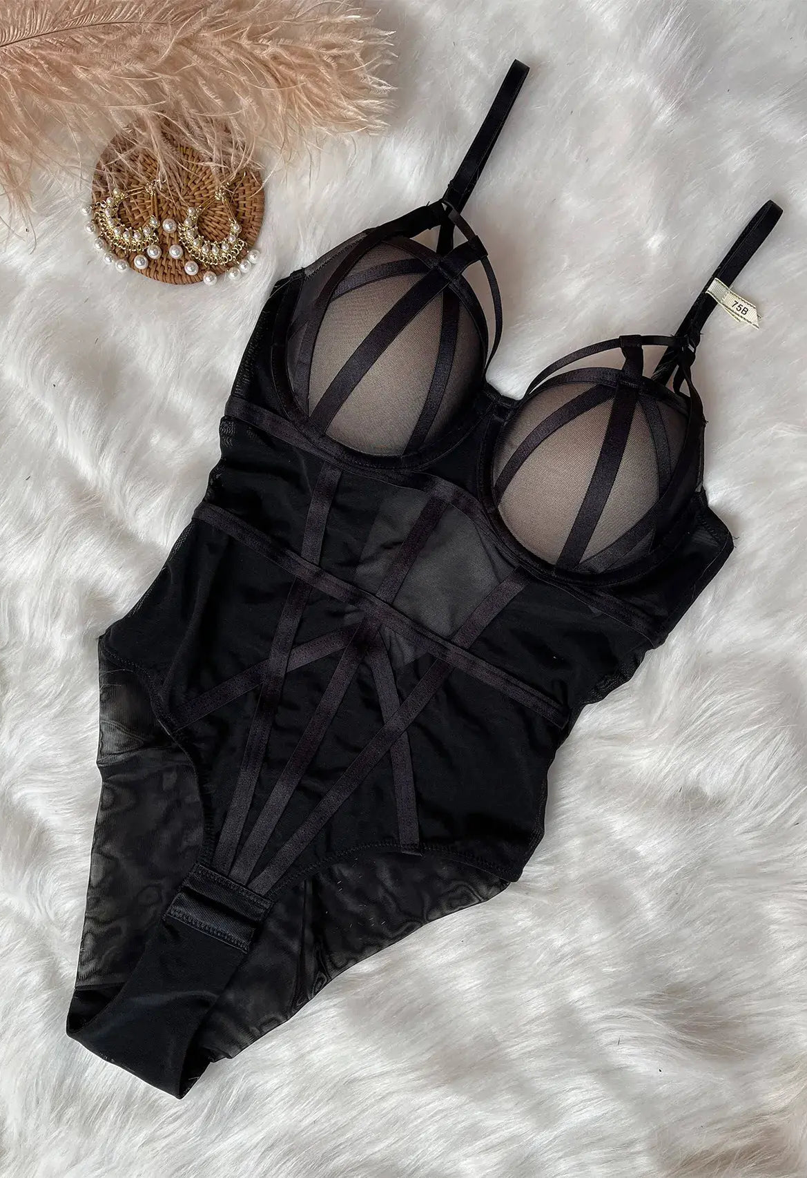Black sheer mesh bodysuit showing lightweight fabric and sensual design style.