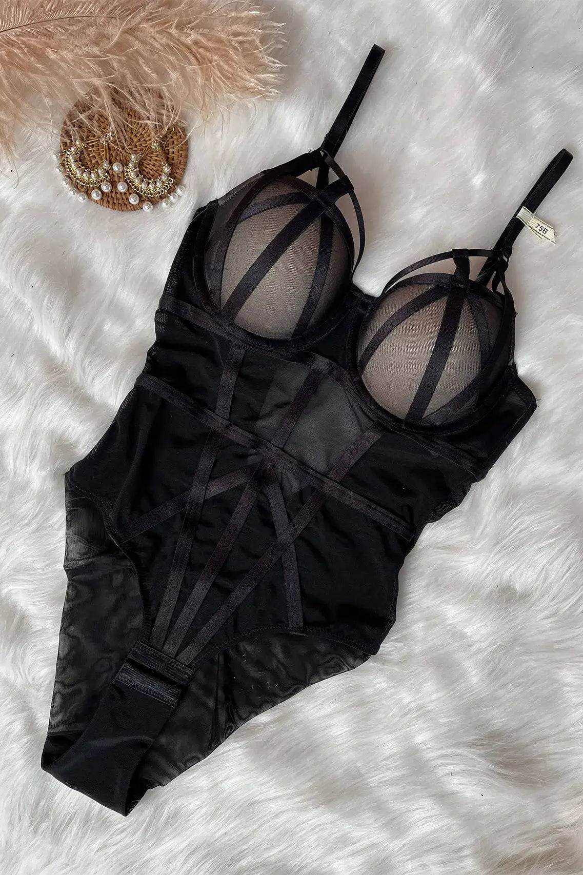 Black sheer mesh bodysuit showing lightweight fabric and sensual design style.