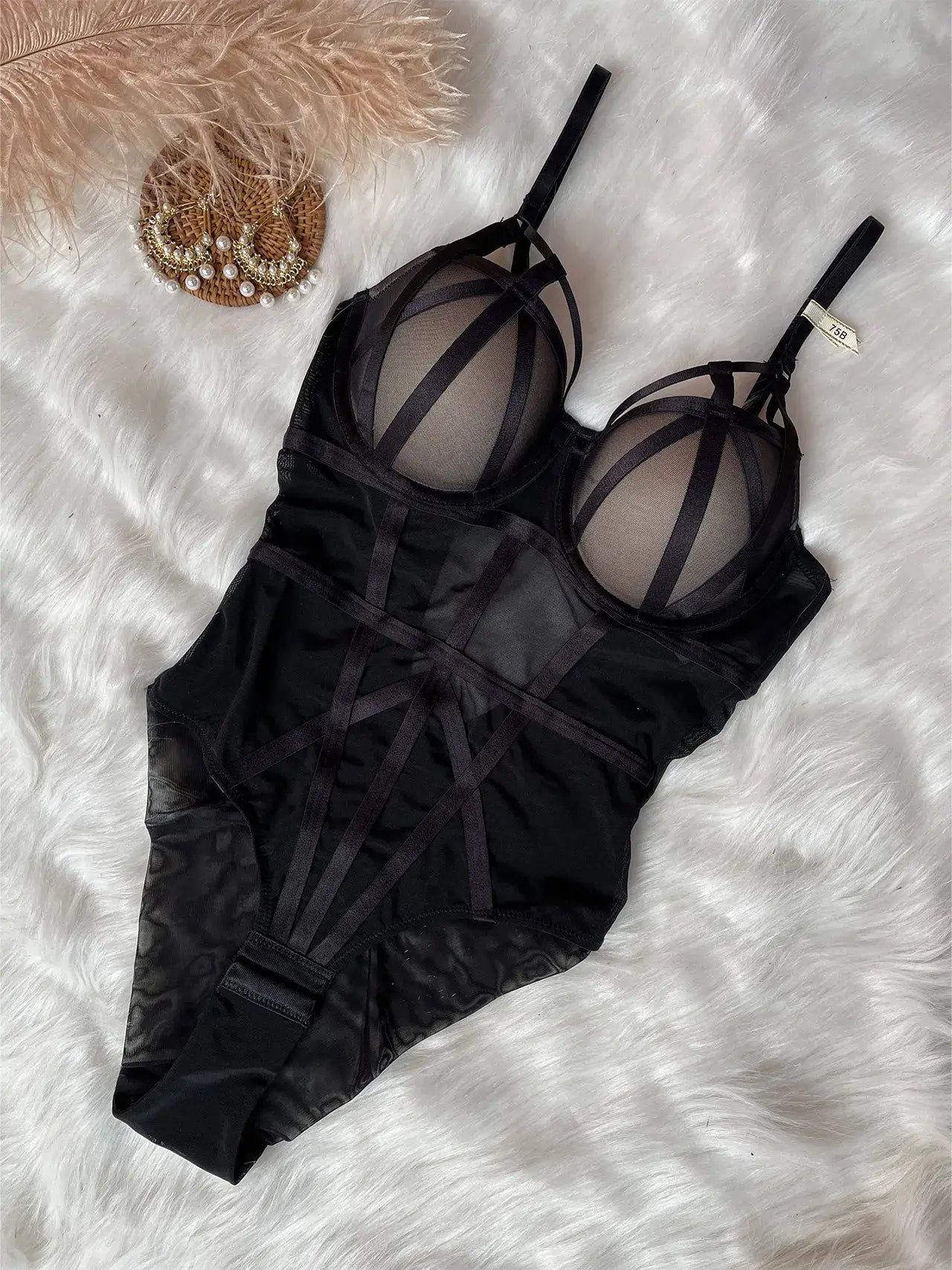 Black sheer mesh bodysuit showing lightweight fabric and sensual design style.