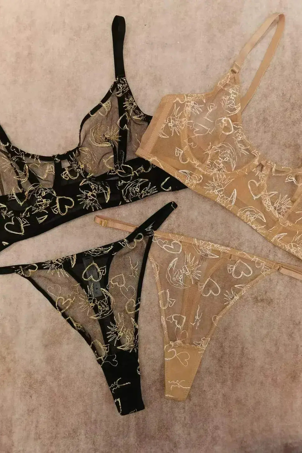 Comparison between Black Gold Sun & Moon Corset Set and Nude Gold Celestial lingerie highlighting color and embroidery contrast.