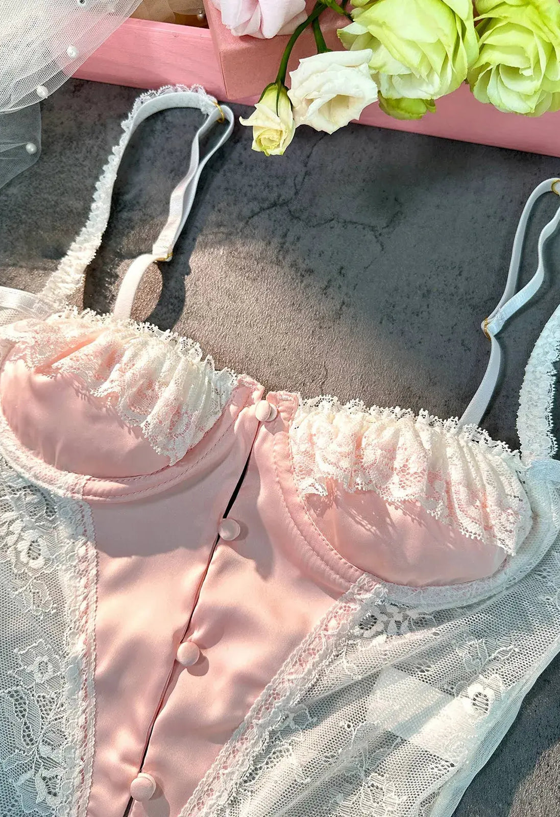 Detailed close-up of bra section on Blush Pink Satin Lace Teddy bodysuit.