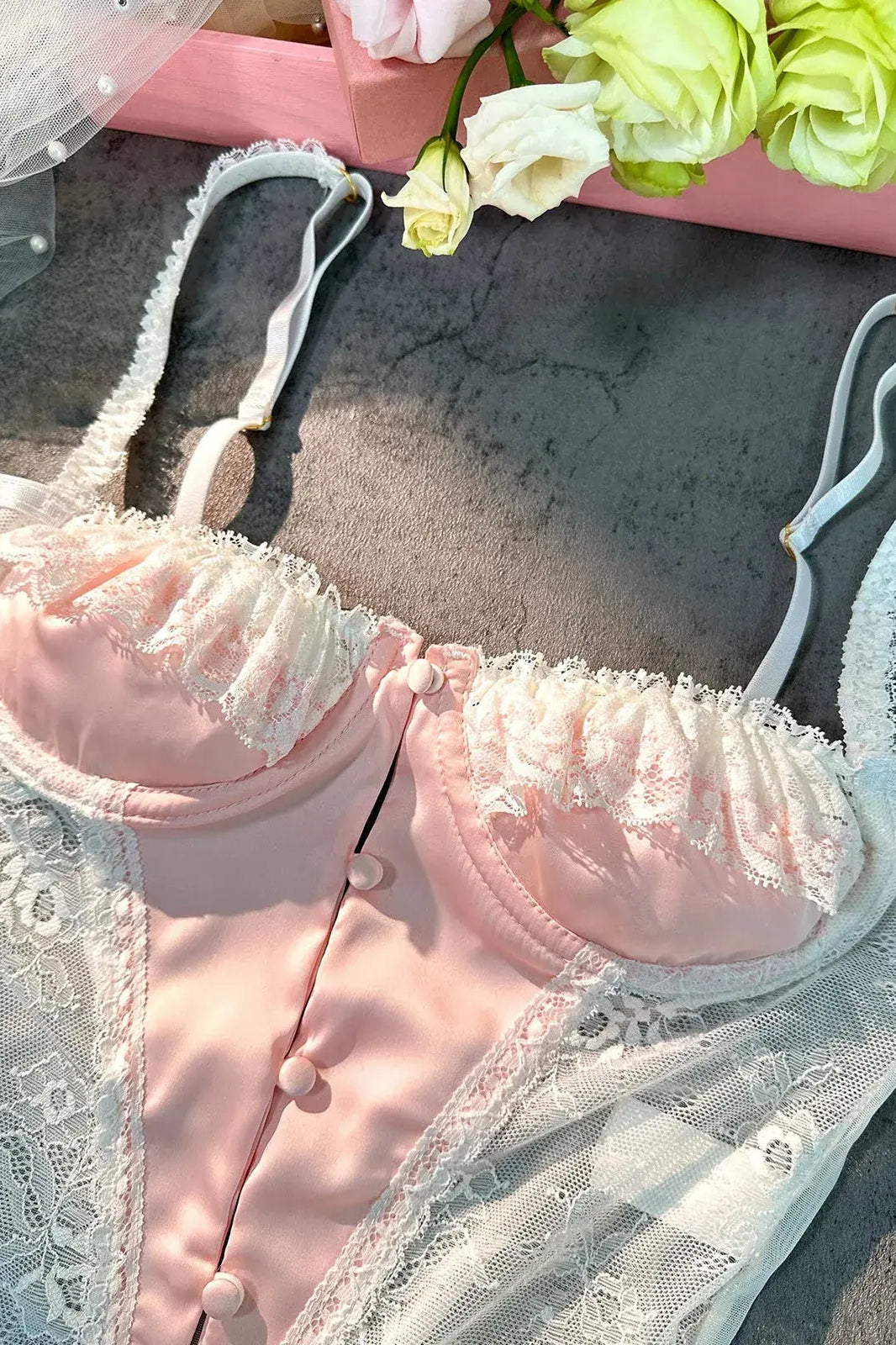 Detailed close-up of bra section on Blush Pink Satin Lace Teddy bodysuit.