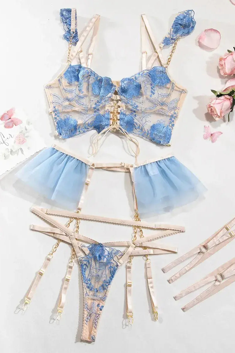 Layflat view of Celestial Whisper embroidered corset set in blue, including bustier and garter belt for boudoir photoshoot