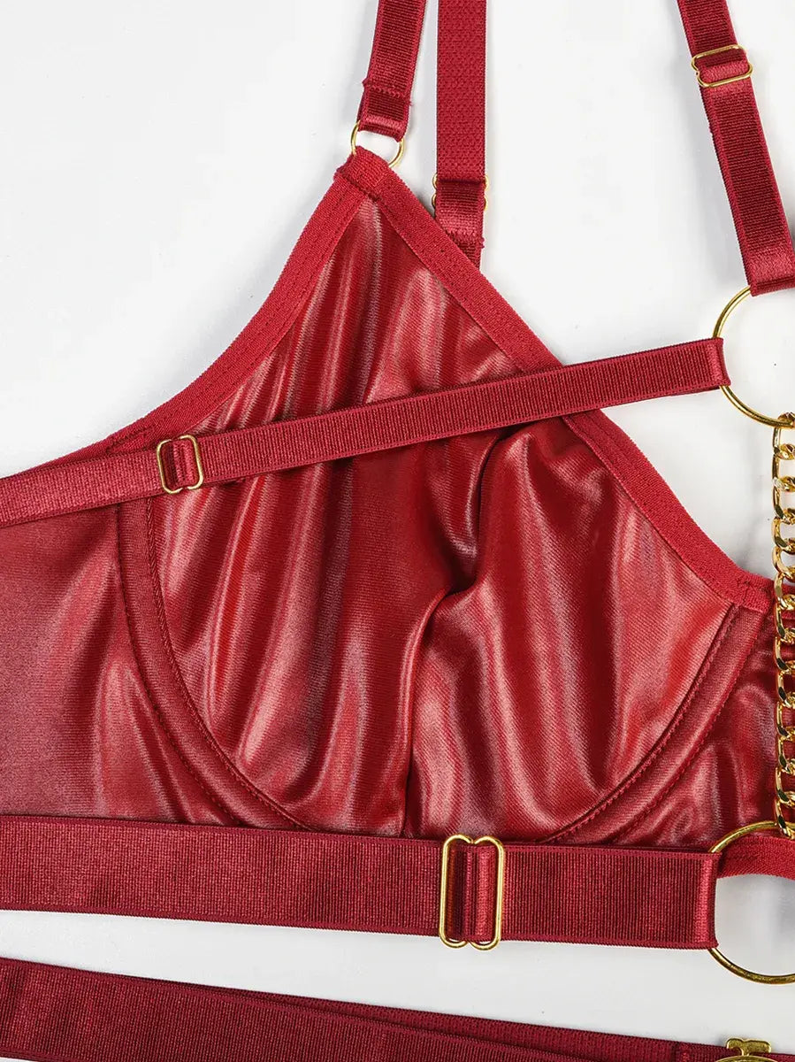 Close-up of burgundy PU leather highlighting precise seams and detailed craftsmanship from the Crimson Obsession set.