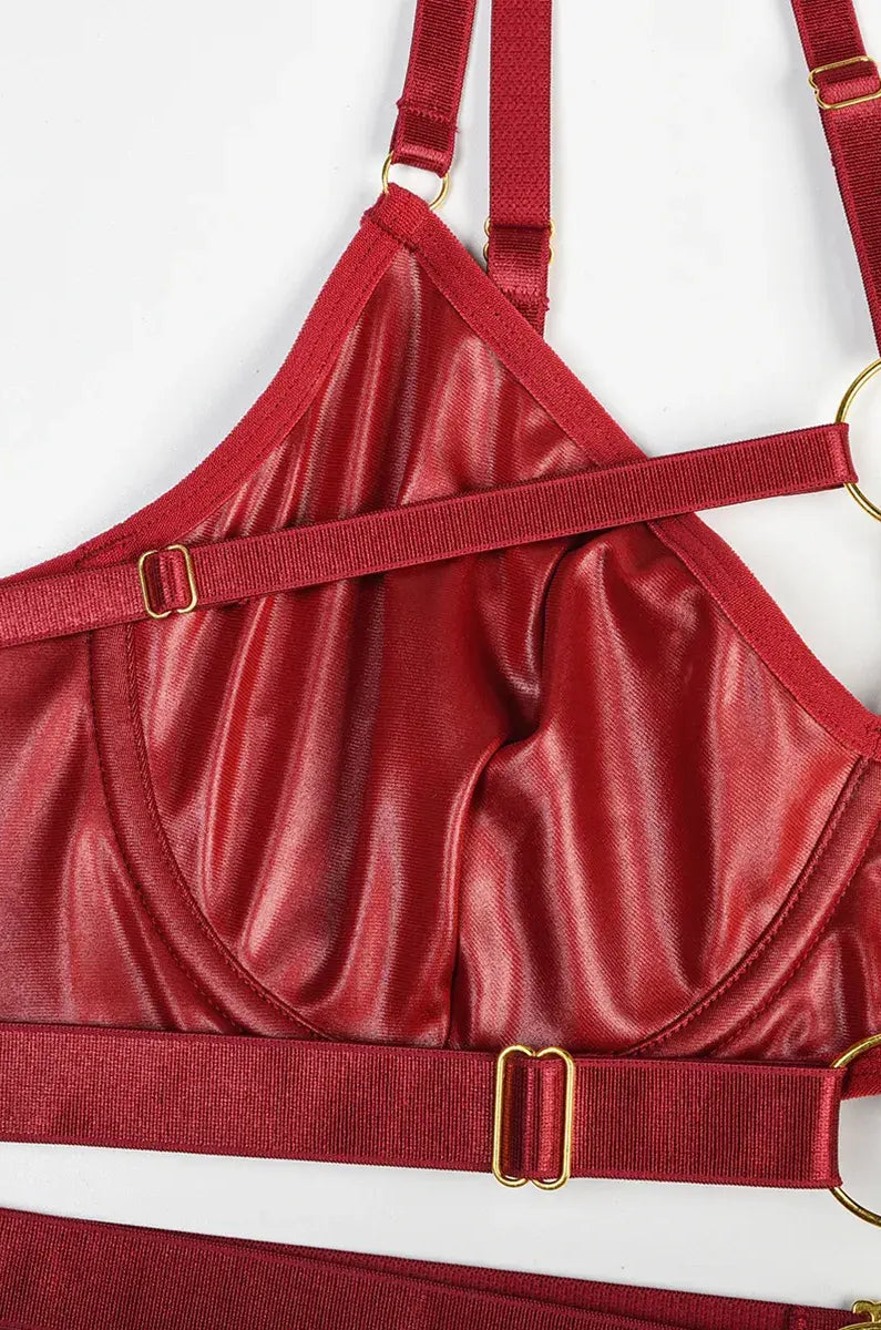 Close-up of burgundy PU leather highlighting precise seams and detailed craftsmanship from the Crimson Obsession set.