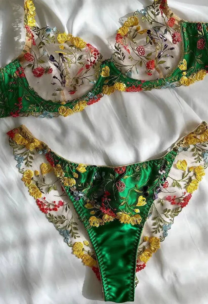 Green bra and satin shorts lingerie set, flatlay display showing embroidery detail
