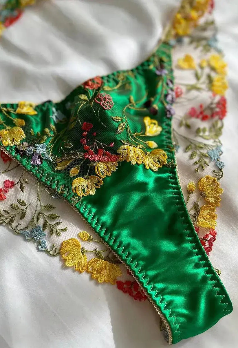 Green thong close-up with embroidered lace and cotton gusset