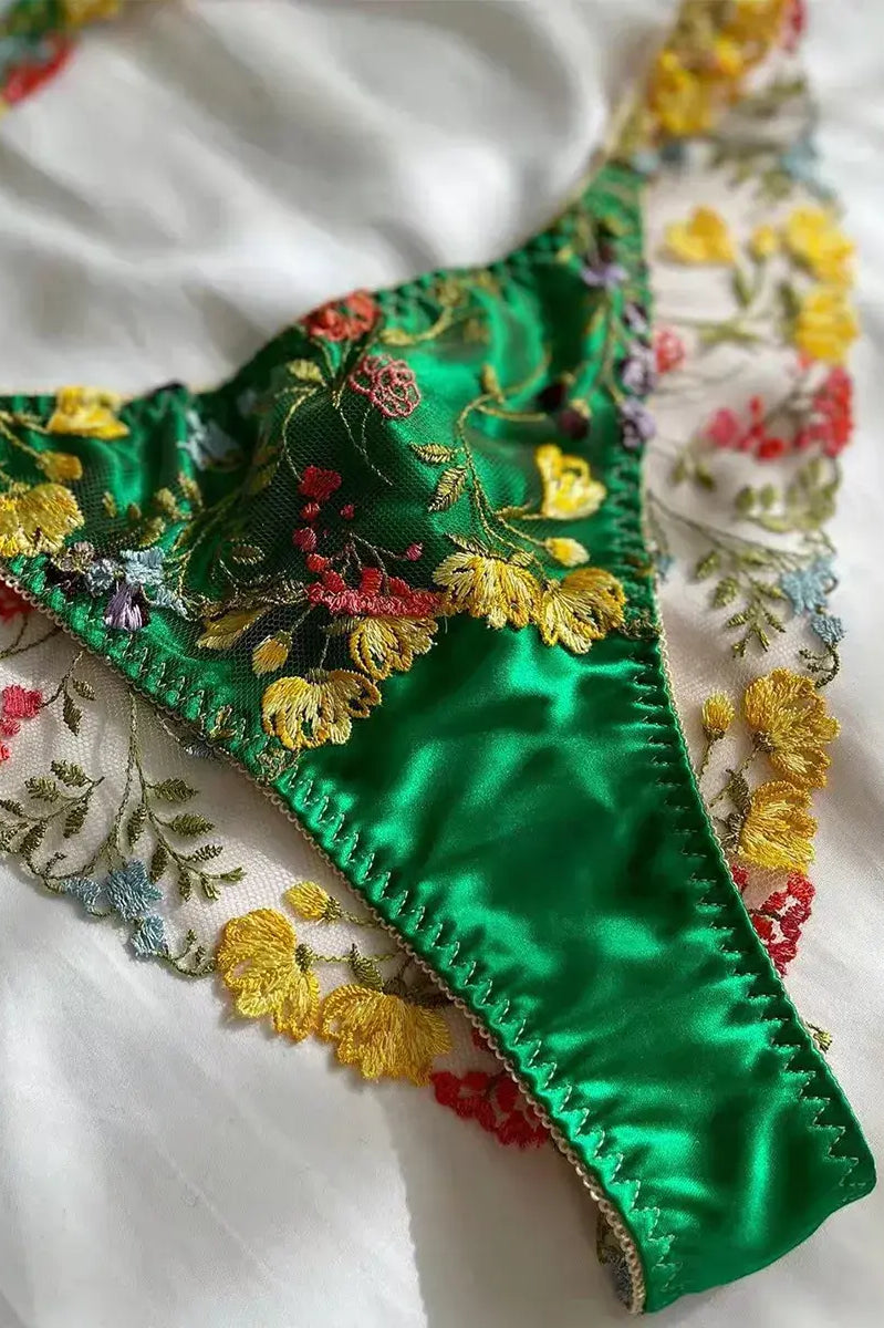 Green thong close-up with embroidered lace and cotton gusset