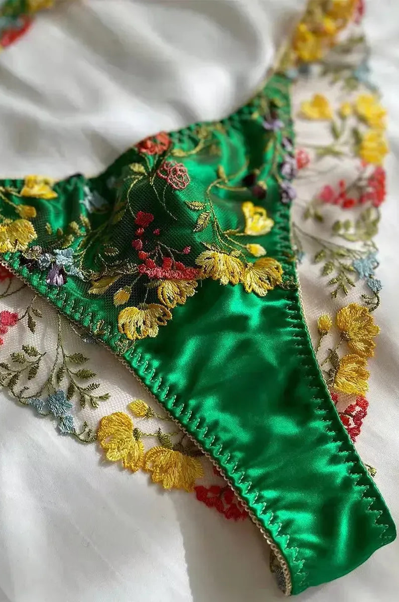 Green thong close-up with embroidered lace and cotton gusset