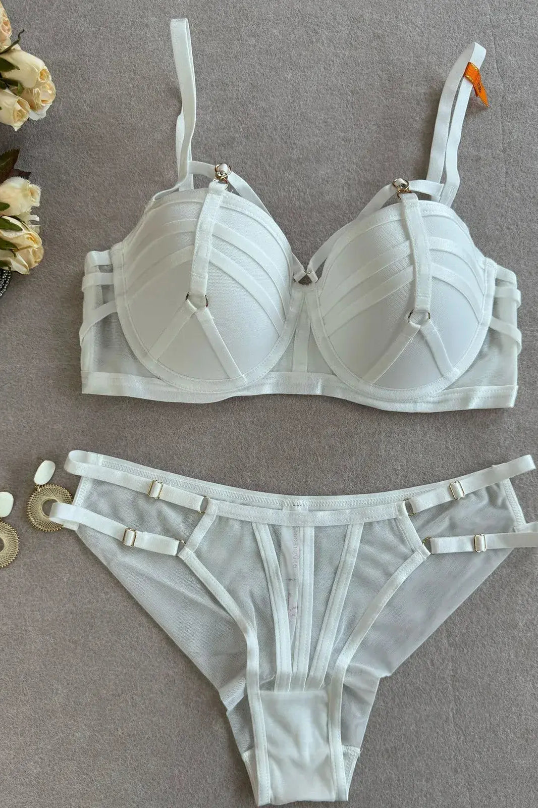 Full outline of Ivory Halo white bra and thong set with structured design