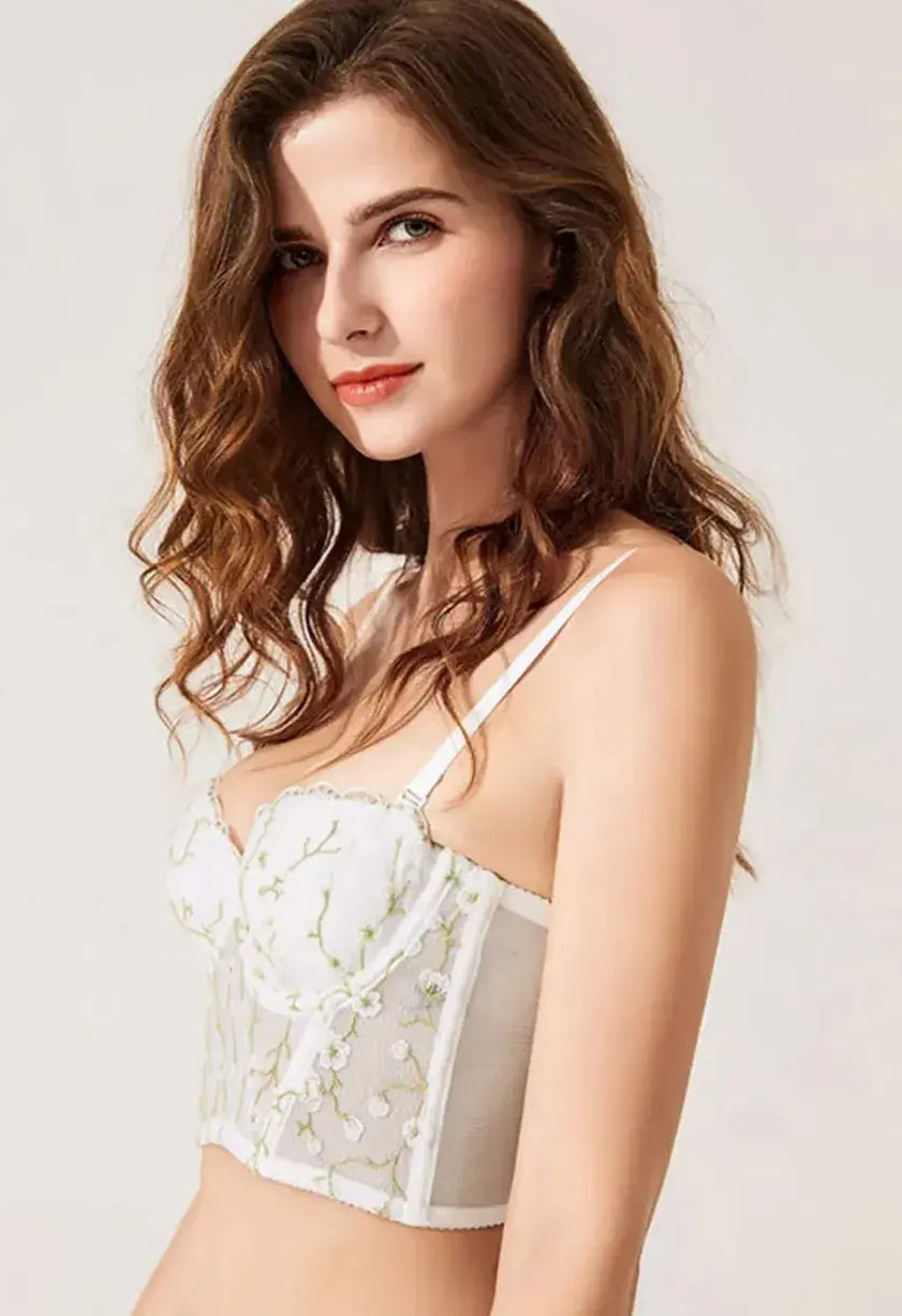 Close-up of lace bra featuring gold embroidery and sheer see-through detailing in the Ivory Whisper set.