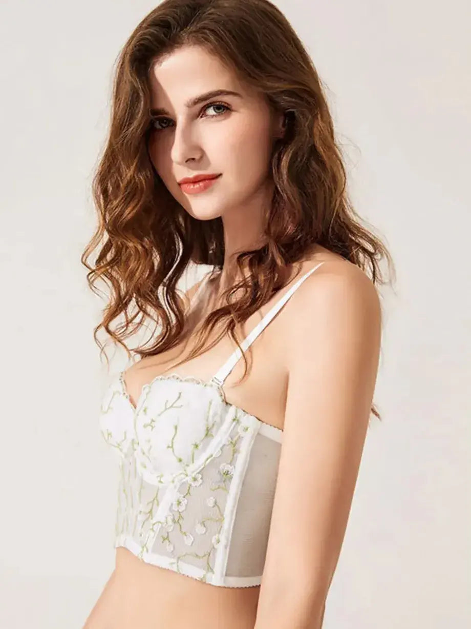 Close-up of lace bra featuring gold embroidery and sheer see-through detailing in the Ivory Whisper set.