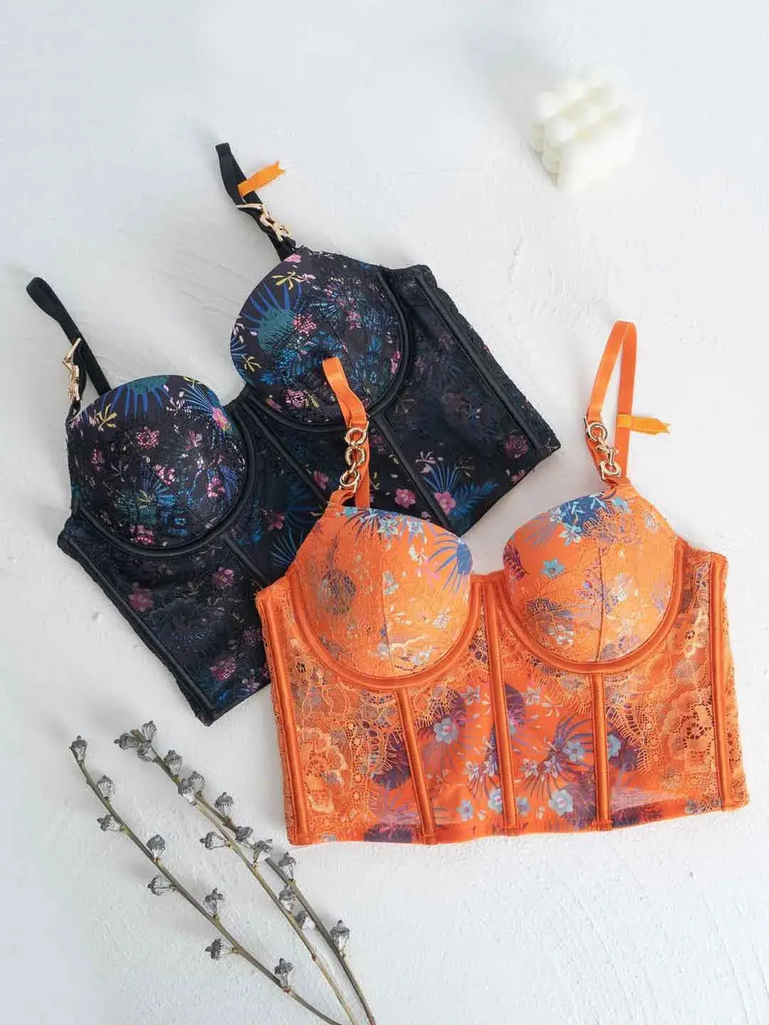 Lace lingerie set flatlay in orange and black color options.