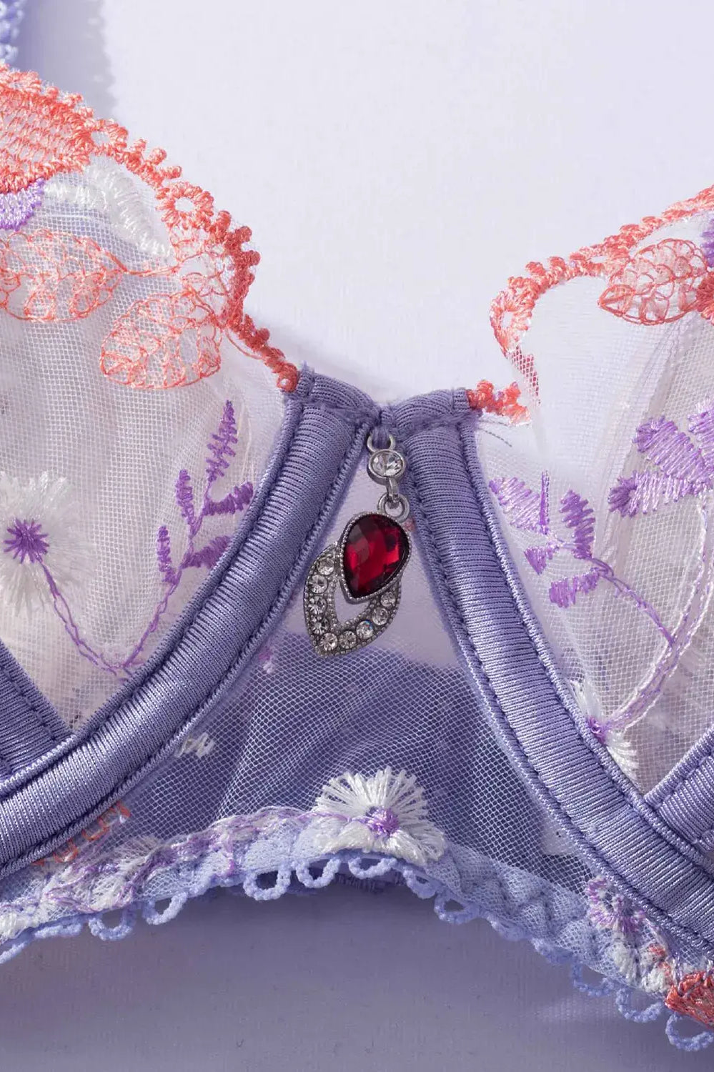 Lavender Bloom lace bra with sheer floral embroidery close-up.