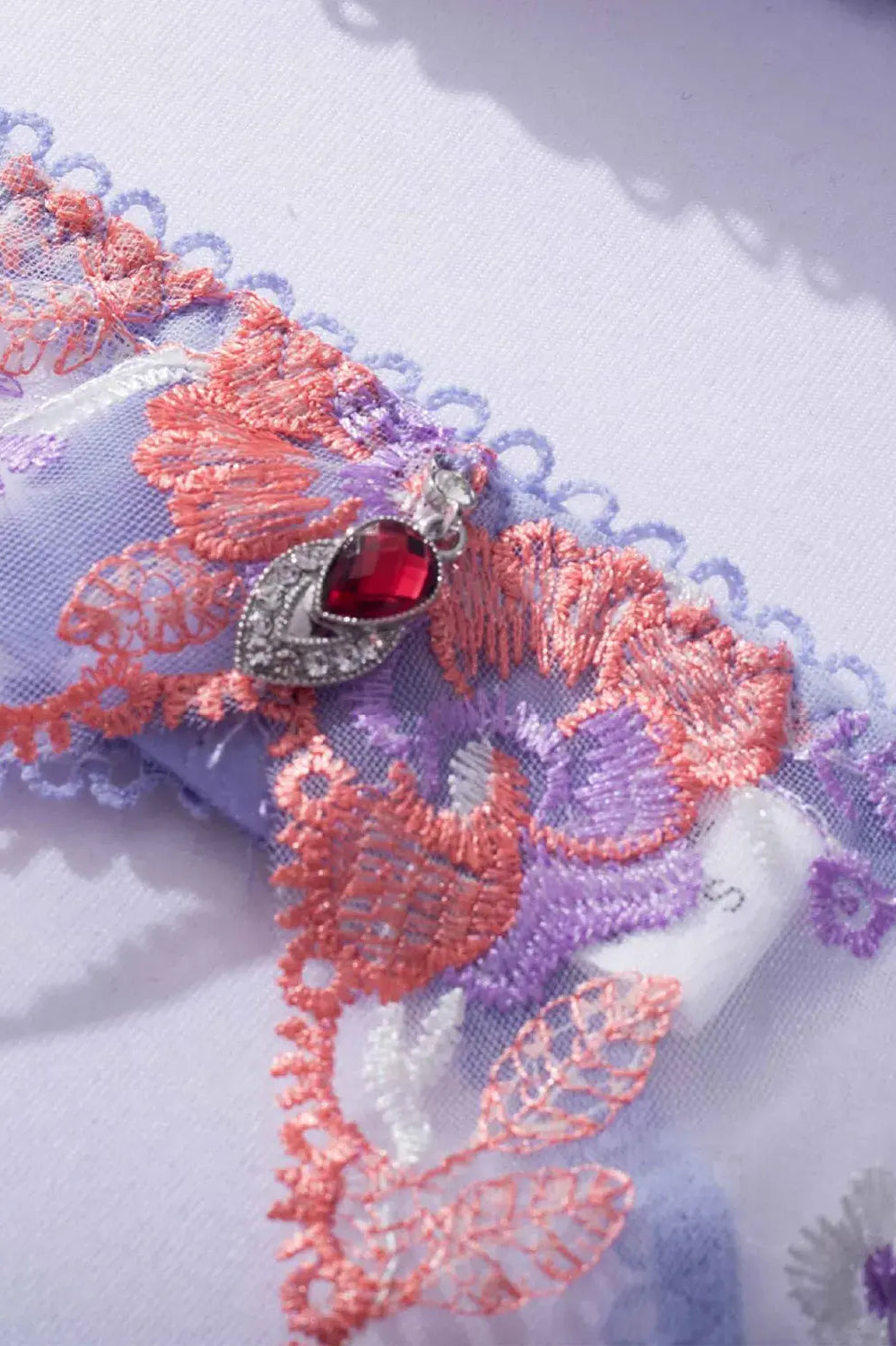 Lavender Bloom lingerie lace waist panel with embroidery and sheer detailing.