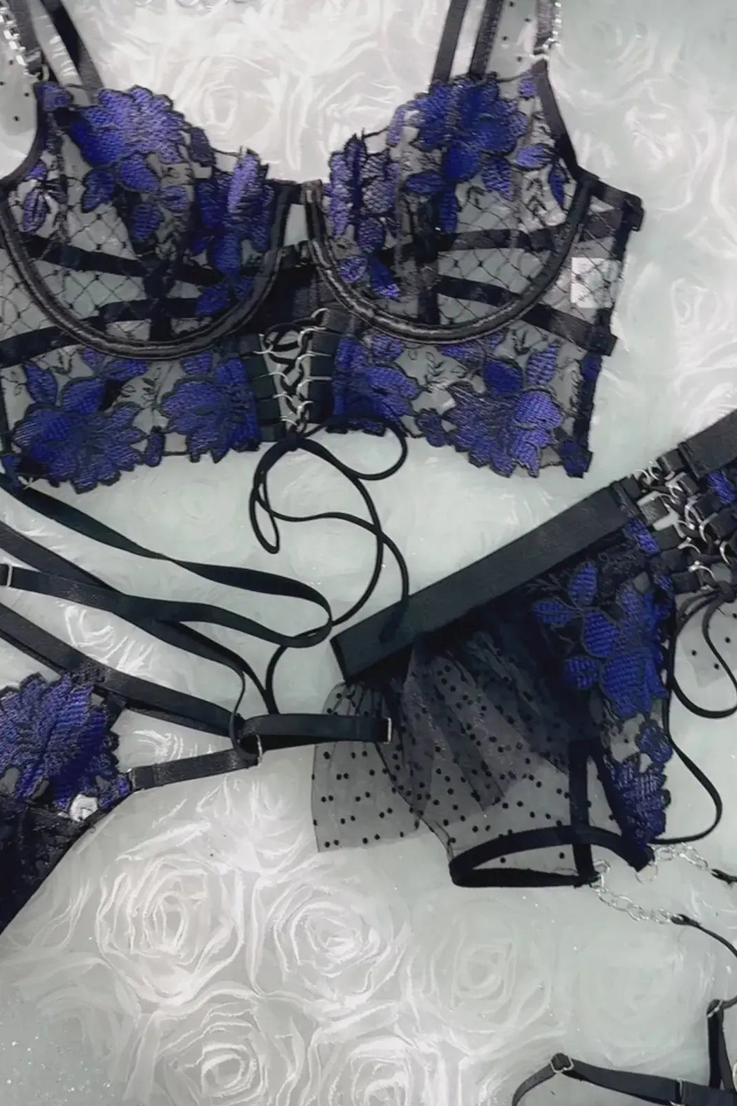 Layflat display of complete Midnight Bloom Lace Corset Set including bustier, waist cincher and garters, luxury black and blue lingerie