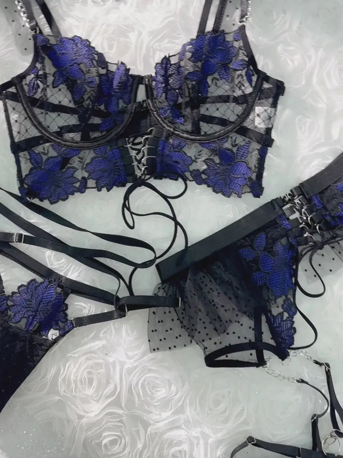 Layflat display of complete Midnight Bloom Lace Corset Set including bustier, waist cincher and garters, luxury black and blue lingerie