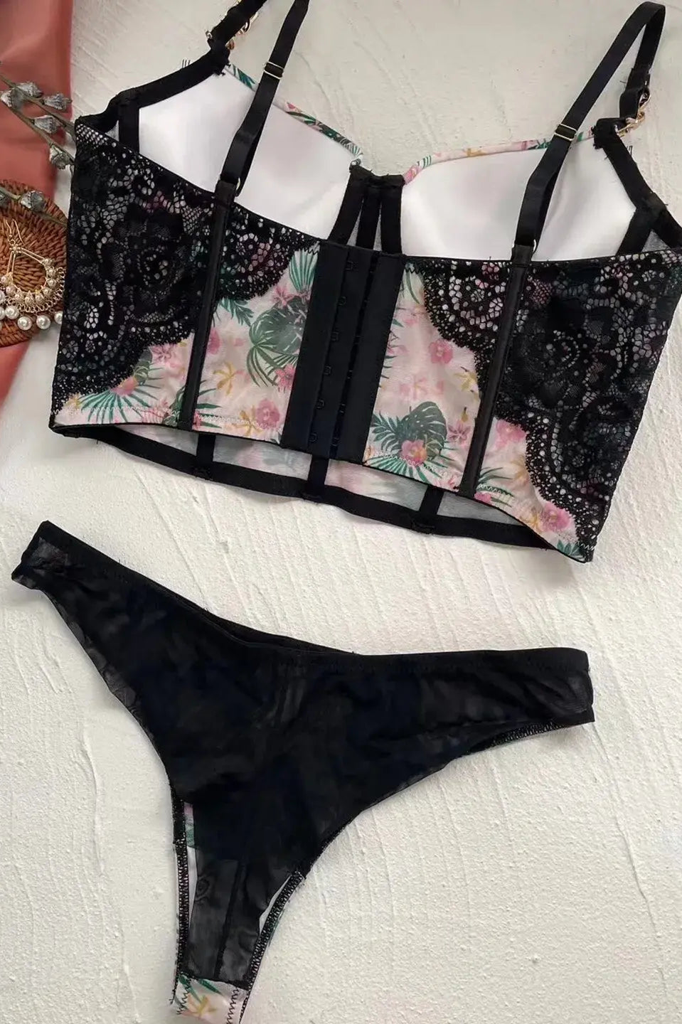 Back flat lay of Moonlight Petal lingerie bodysuit, showcasing sheer mesh and soft corset construction.