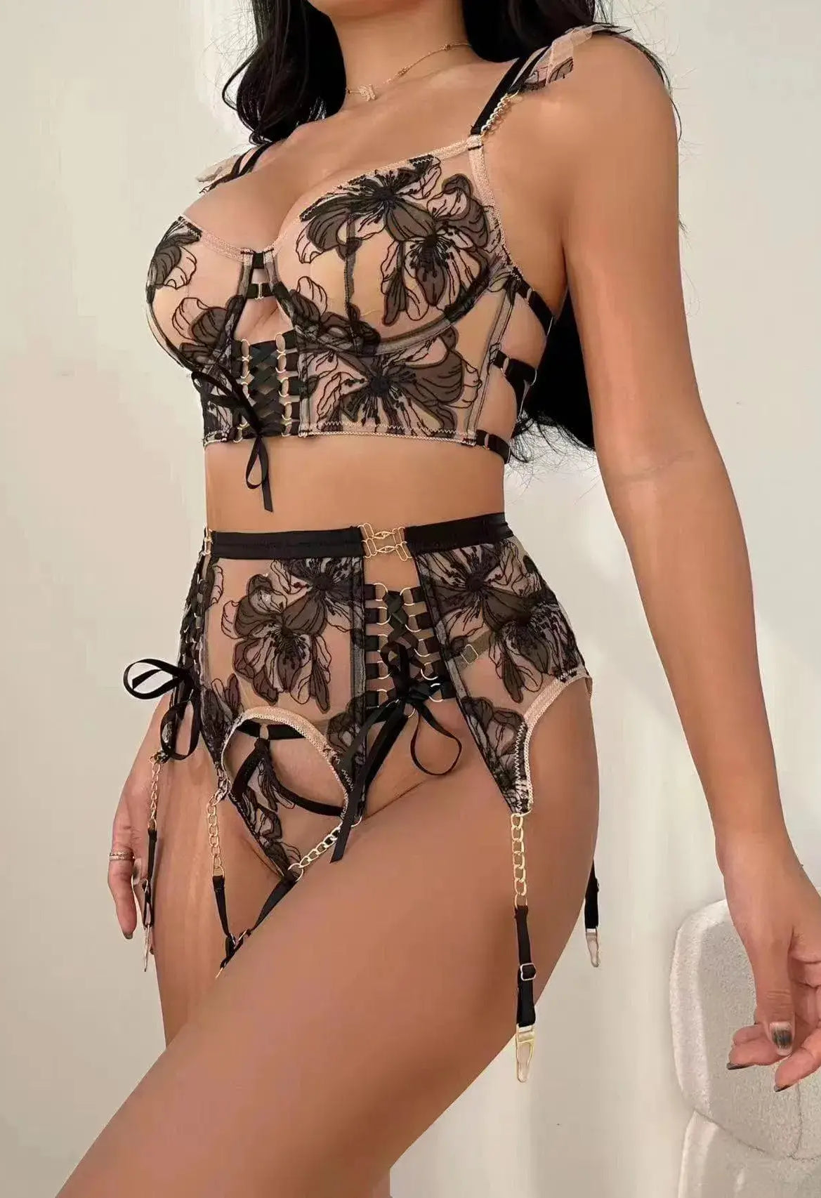 Side view of Noir Eclipse black and gold lingerie set with delicate straps and lace trim, highlighting figure-hugging silhouette