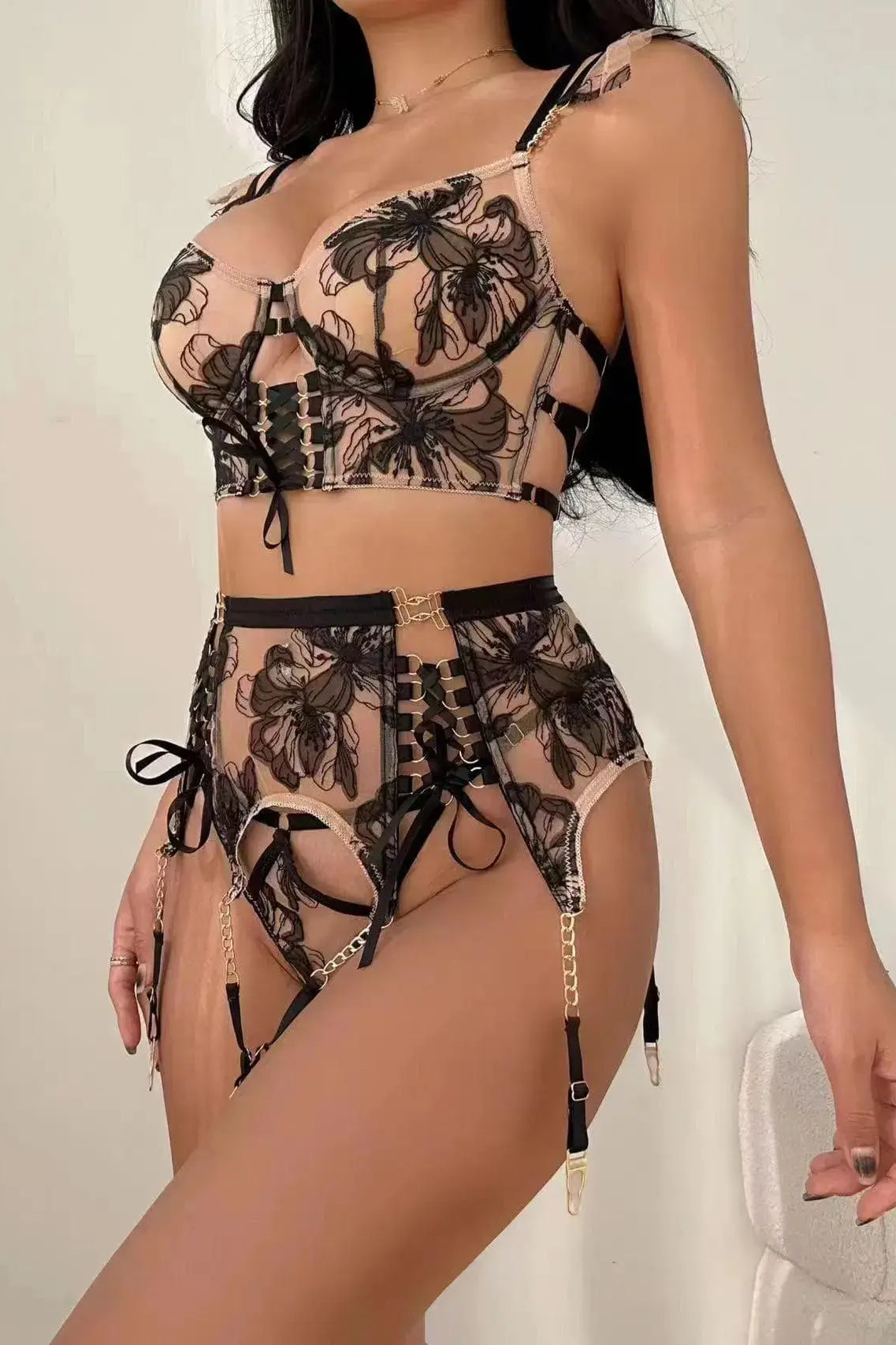 Side view of Noir Eclipse black and gold lingerie set with delicate straps and lace trim, highlighting figure-hugging silhouette