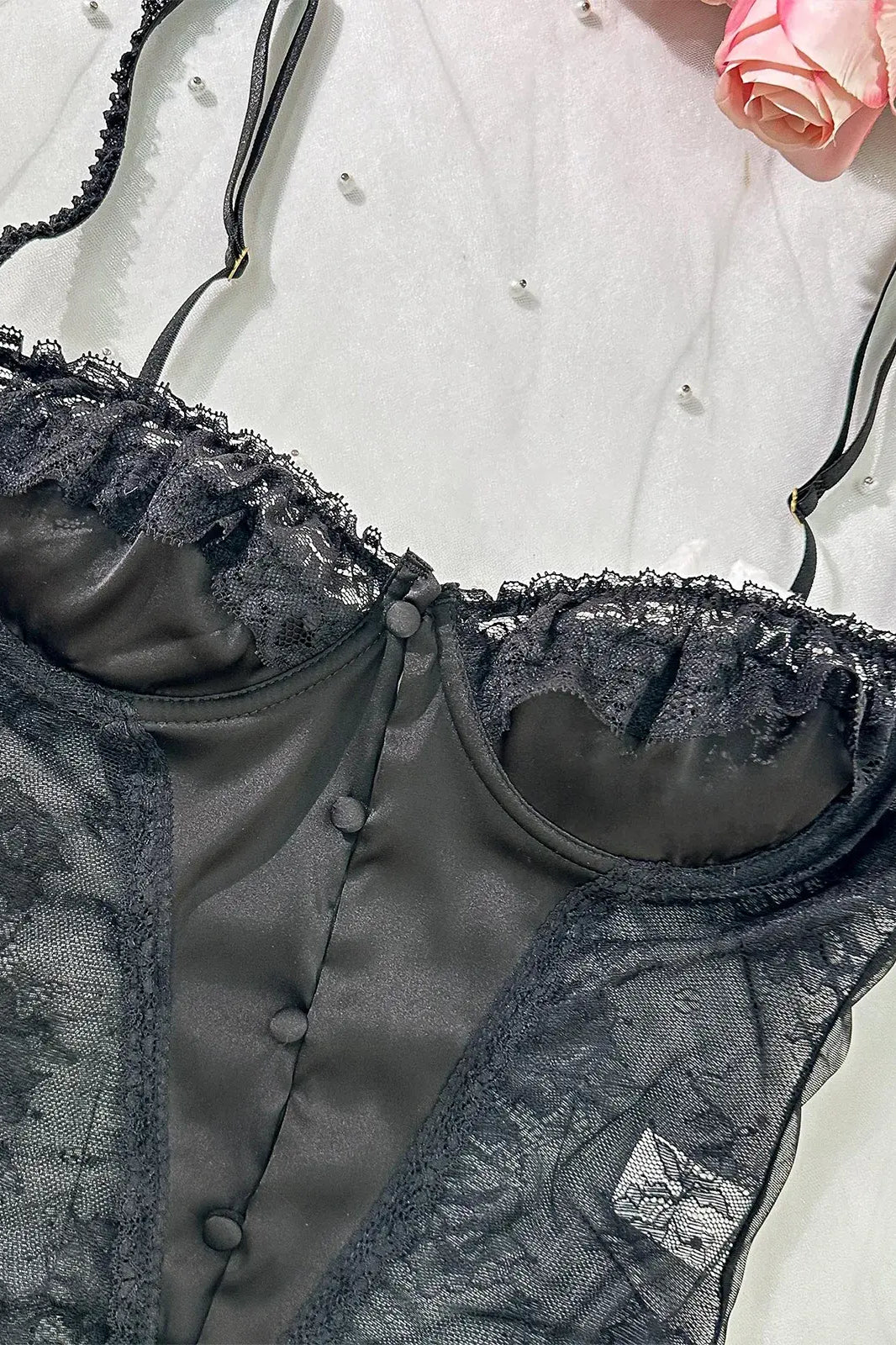 Detailed close-up of bra section on Noir Lace Bodysuit Teddy emphasizing lace craftsmanship.
