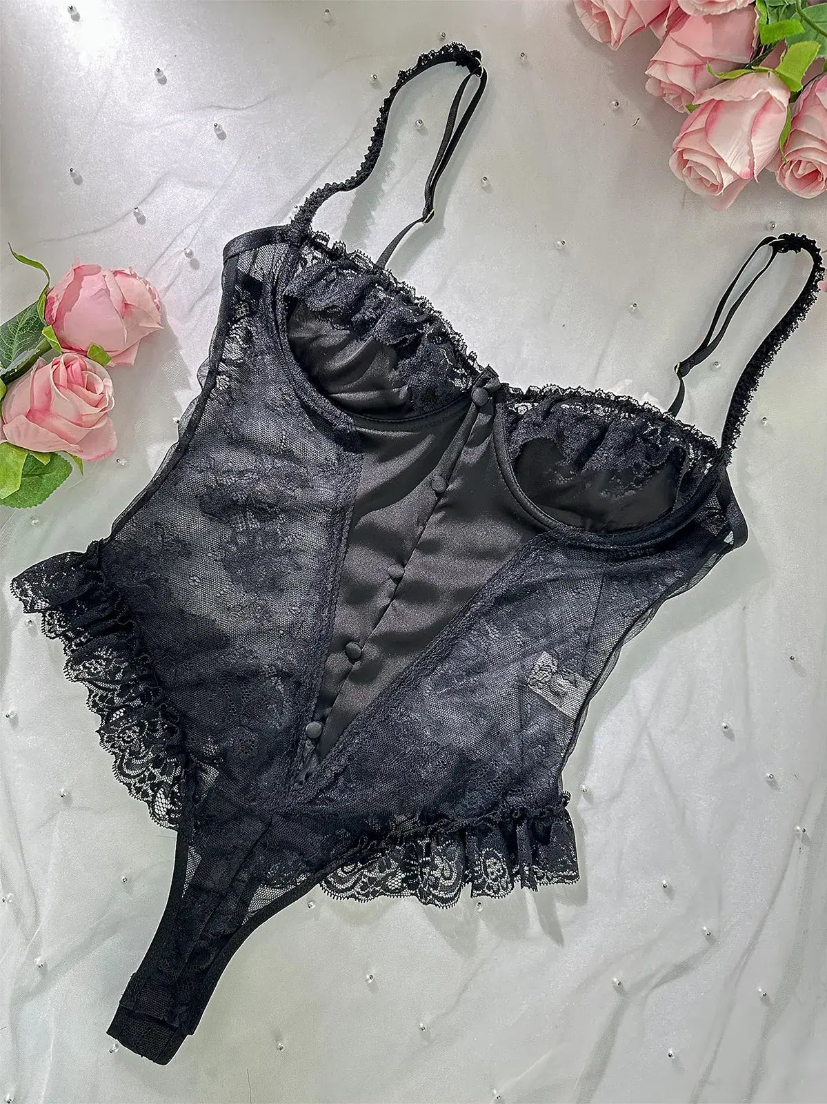 Layflat image showcasing fabric texture and lace patterns of Noir Lace Bodysuit Teddy.
