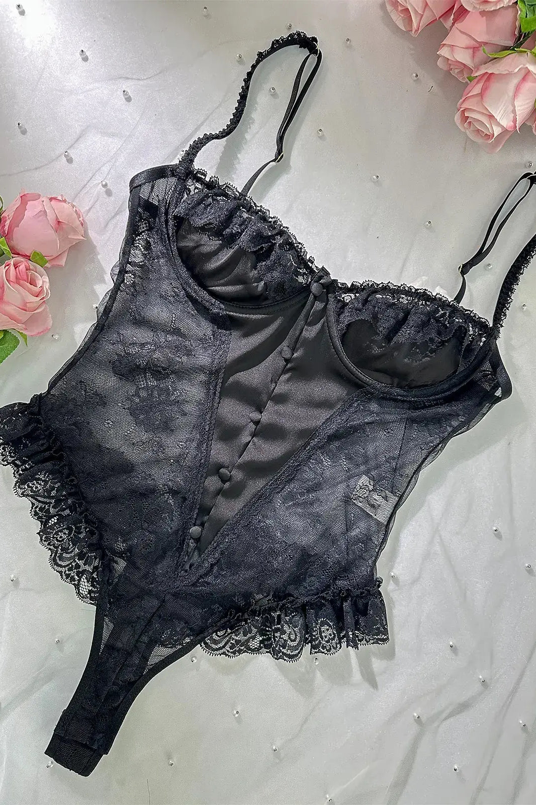Layflat image showcasing fabric texture and lace patterns of Noir Lace Bodysuit Teddy.