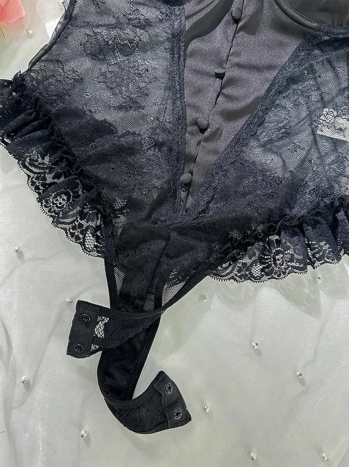 Close-up of open crotch design on Noir Lace Bodysuit Teddy highlighting functional detail.