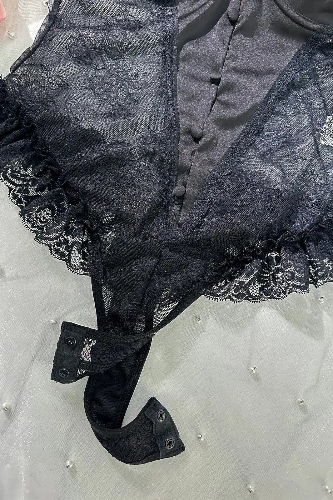 Close-up of open crotch design on Noir Lace Bodysuit Teddy highlighting functional detail.