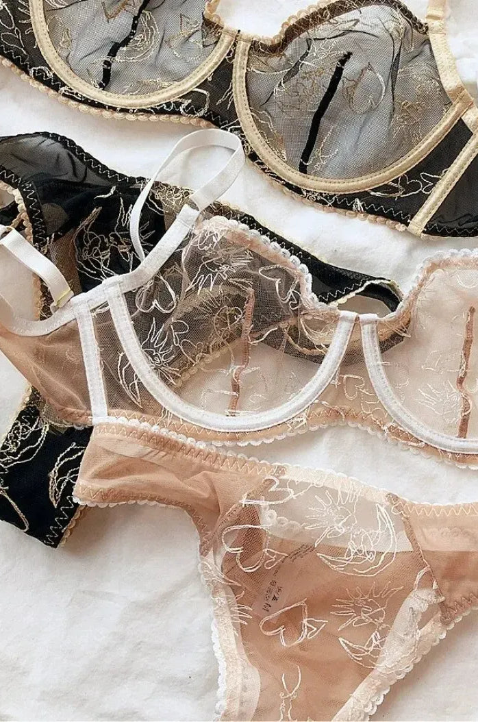 Detailed close-up of sheer mesh and lace in Nude Lace Women Underwear Set and Black Gold corset set.