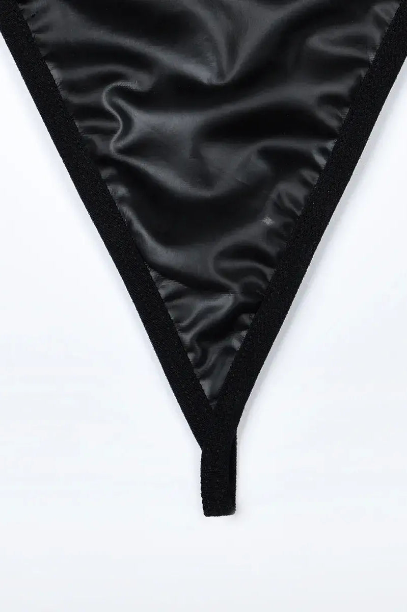 Comfortable black PU thong with soft lining and flattering fit, designed for both elegance and wearability in the Obsidian Edge set.