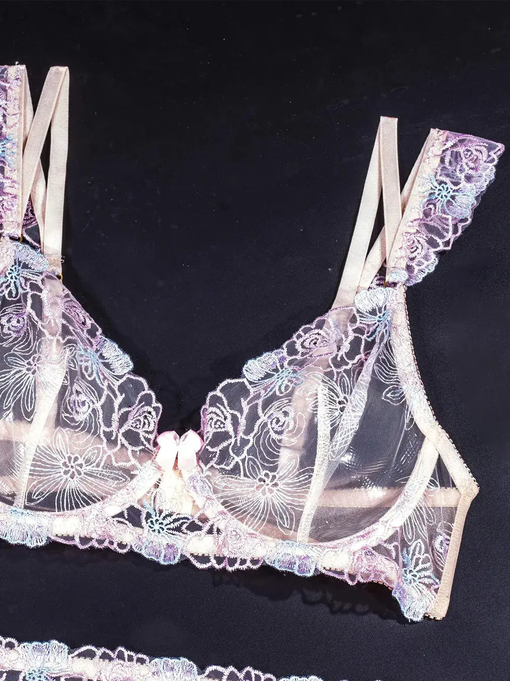 Purple lace cami with delicate embroidery and matching bra.