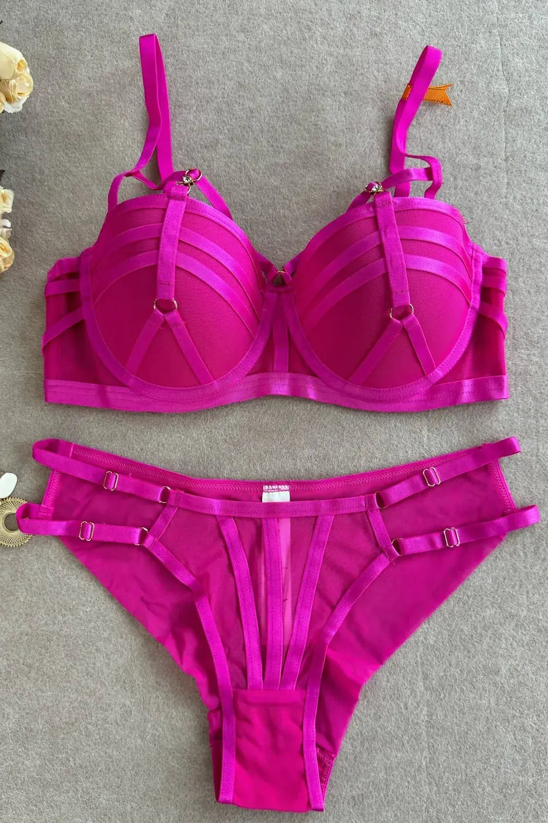 Full view of purple bra and thong lingerie set highlighting structured design