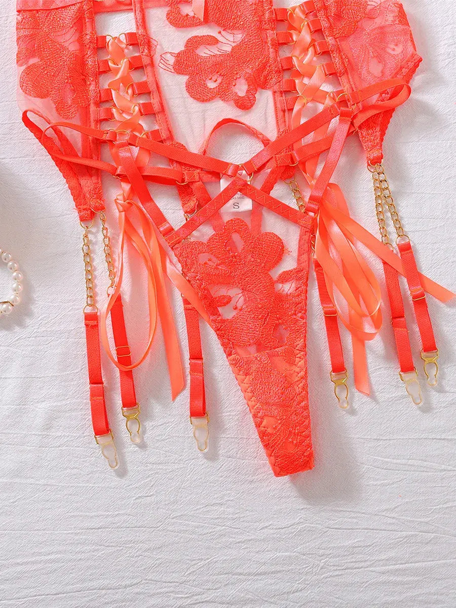 Close-up of orange lace corset belt and garter straps with reinforced stitching