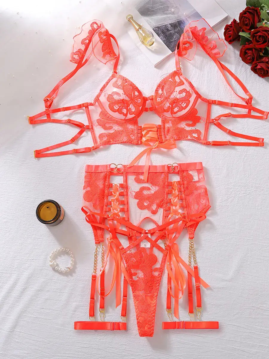 Complete Sunset Ember orange lace corset set displayed flat including bustier and garter belt
