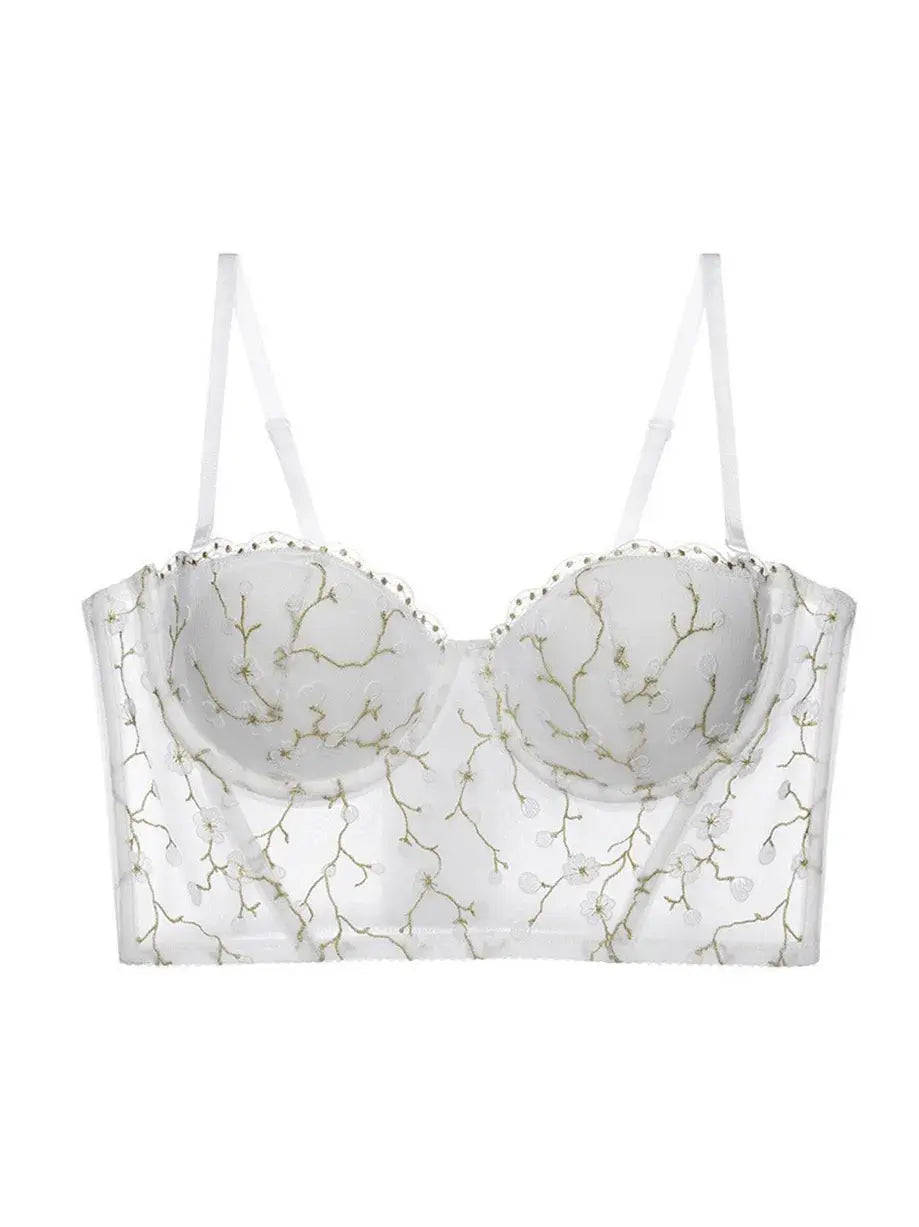 Ivory bustier top lingerie piece displayed in full view, combining sheer mesh and gold embroidery for a luxe look.