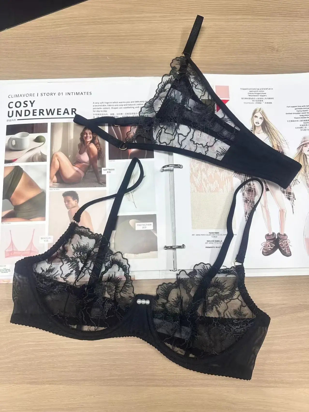 Detailed view of black sheer lingerie set highlighting exquisite craftsmanship and fabric texture.