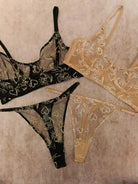 Comparison between Black Gold Sun & Moon Corset Set and Nude Gold Celestial lingerie highlighting color and embroidery contrast.