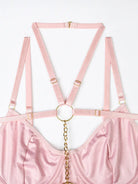 Layered pink elastic bands with luxe gold rings and metal accents, adding modern edge to the Blush Bond lingerie set.