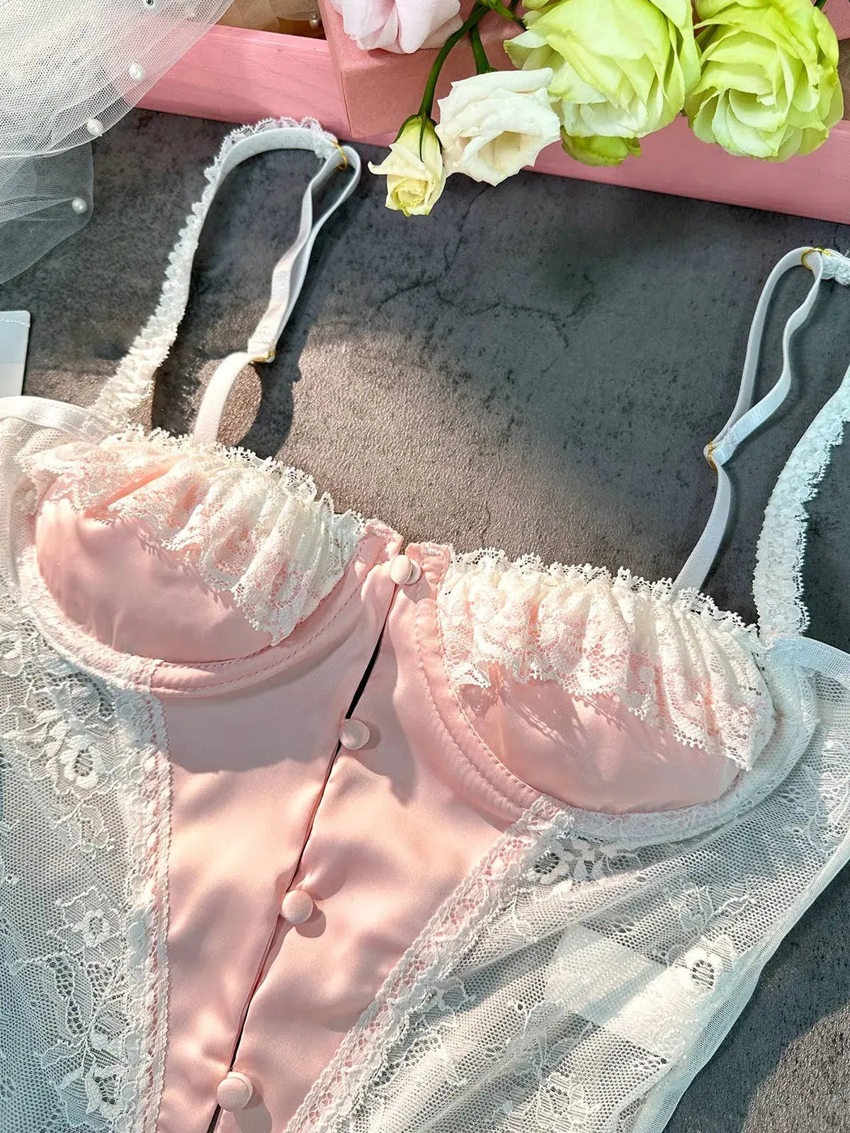 Detailed close-up of bra section on Blush Pink Satin Lace Teddy bodysuit.