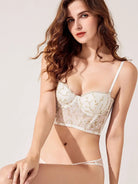 Front angle of sheer ivory lingerie bodysuit showcasing confident curves and feminine lace elegance.