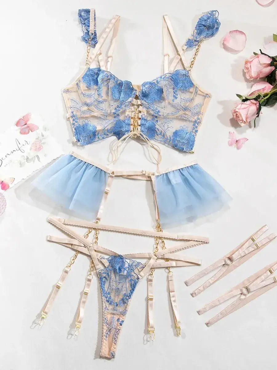 Layflat view of Celestial Whisper embroidered corset set in blue, including bustier and garter belt for boudoir photoshoot