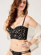 Corset top and panty lingerie set in black and gold, featuring floral lace and detailed embroidery craftsmanship.