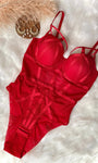Crimson Heat strappy bodysuit with open-crotch hook closure detail.
