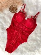 Crimson Heat strappy bodysuit with open-crotch hook closure detail.