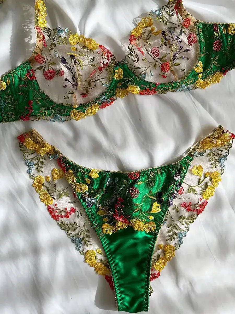 Green bra and satin shorts lingerie set, flatlay display showing embroidery detail