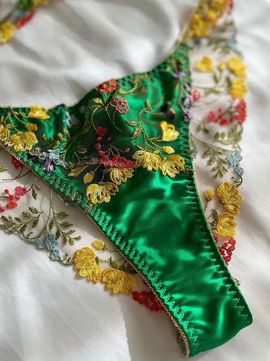 Green thong close-up with embroidered lace and cotton gusset