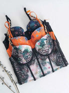 Lace lingerie set flatlay in orange, black, and white color variations.
